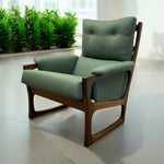 Load image into Gallery viewer, Green armchair with wooden frame in a room with plants
