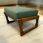 Load image into Gallery viewer, Wooden ottoman with a green cushion on a light-colored floor.
