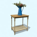 Load image into Gallery viewer, Wooden side table with a blue pitcher and flowers on a light blue background
