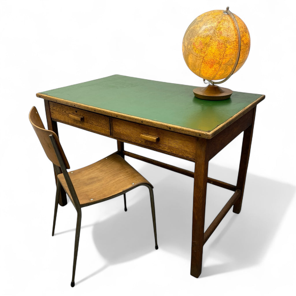 Vintage desk with green top and wooden chair on a white background