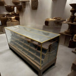 Load image into Gallery viewer, Display case with glass front and wooden frame in a room with decorative items on the wall.
