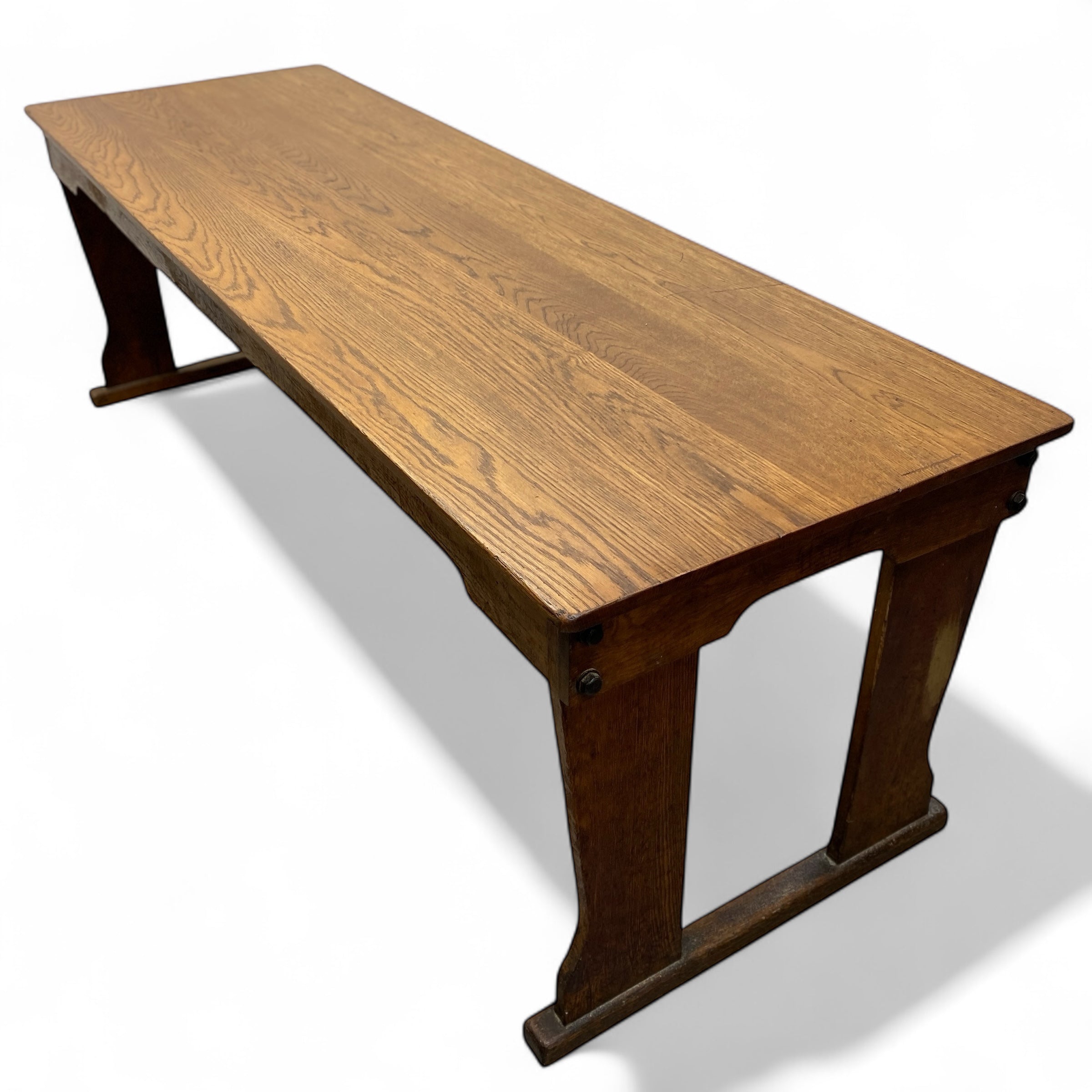 Wooden refectory table with a white background