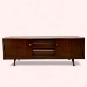 Wooden sideboard with a minimalist design on a white background