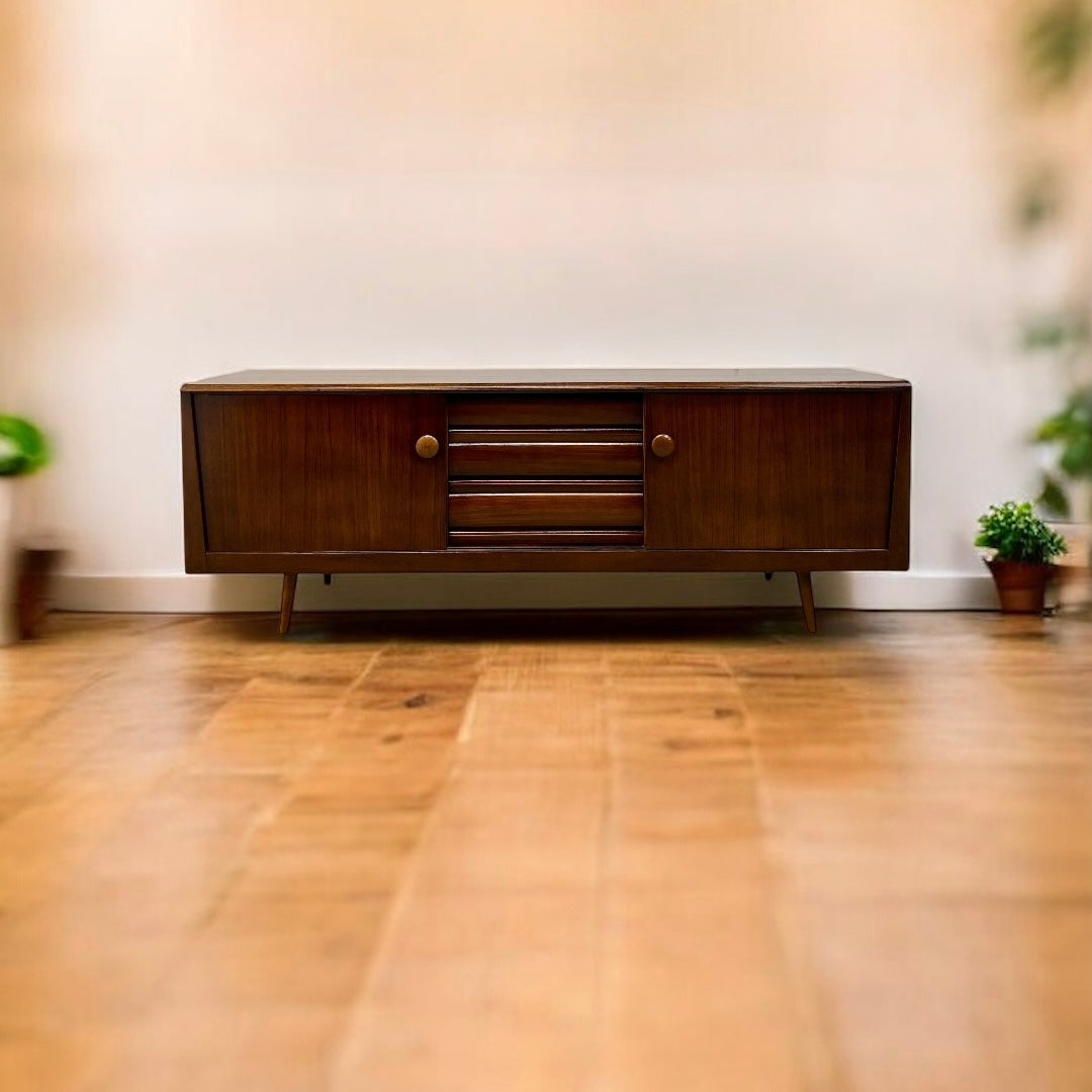 Wooden sideboard in a room with wooden floor and blurred background