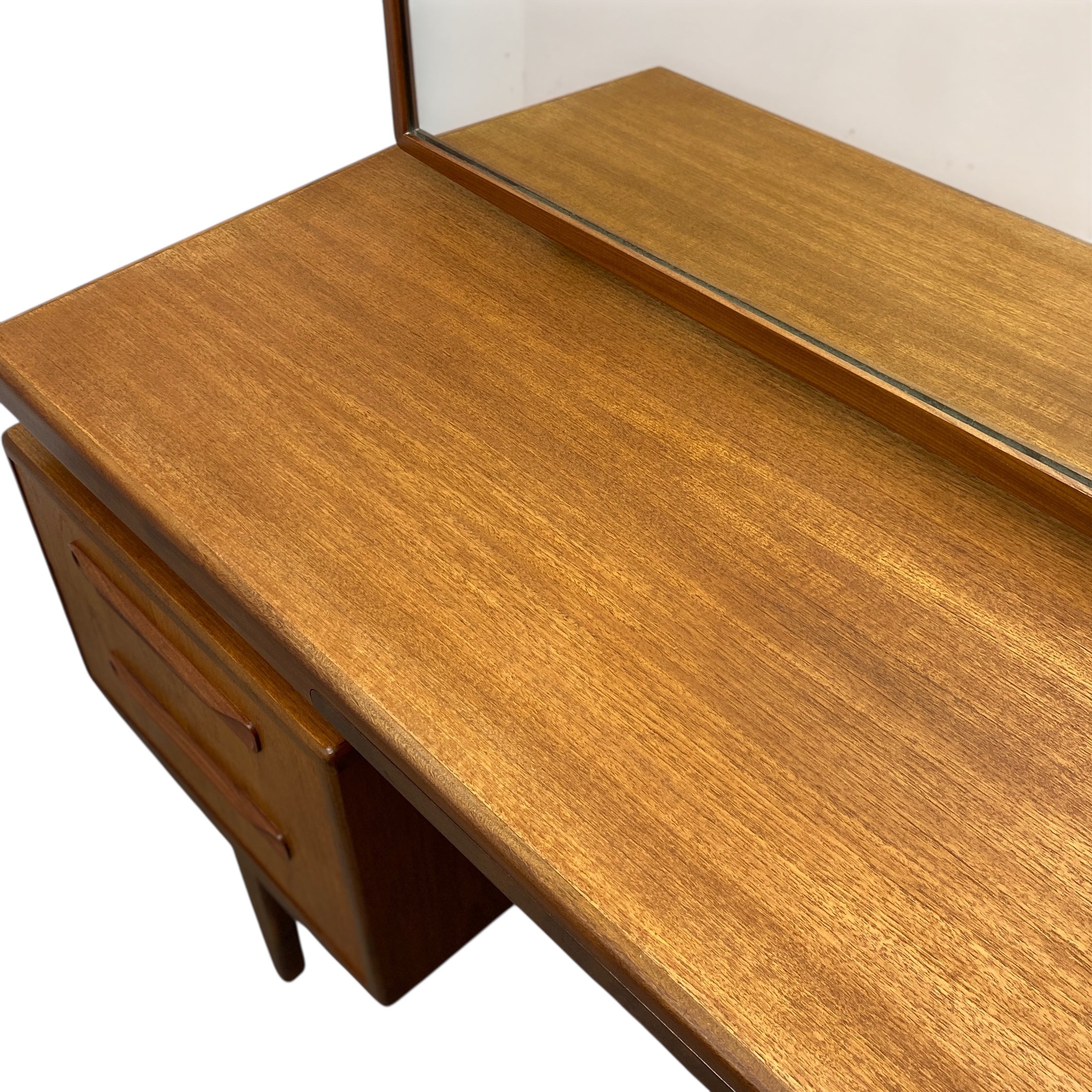 Wooden dressing table  with a mirror on a white background