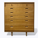Load image into Gallery viewer, Wooden dresser with seven drawers on a white background
