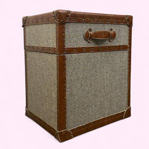 Vintage-style trunk with brown leather accents on a white background