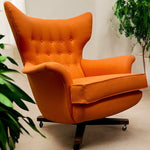 Load image into Gallery viewer, Orange armchair in a room with plants
