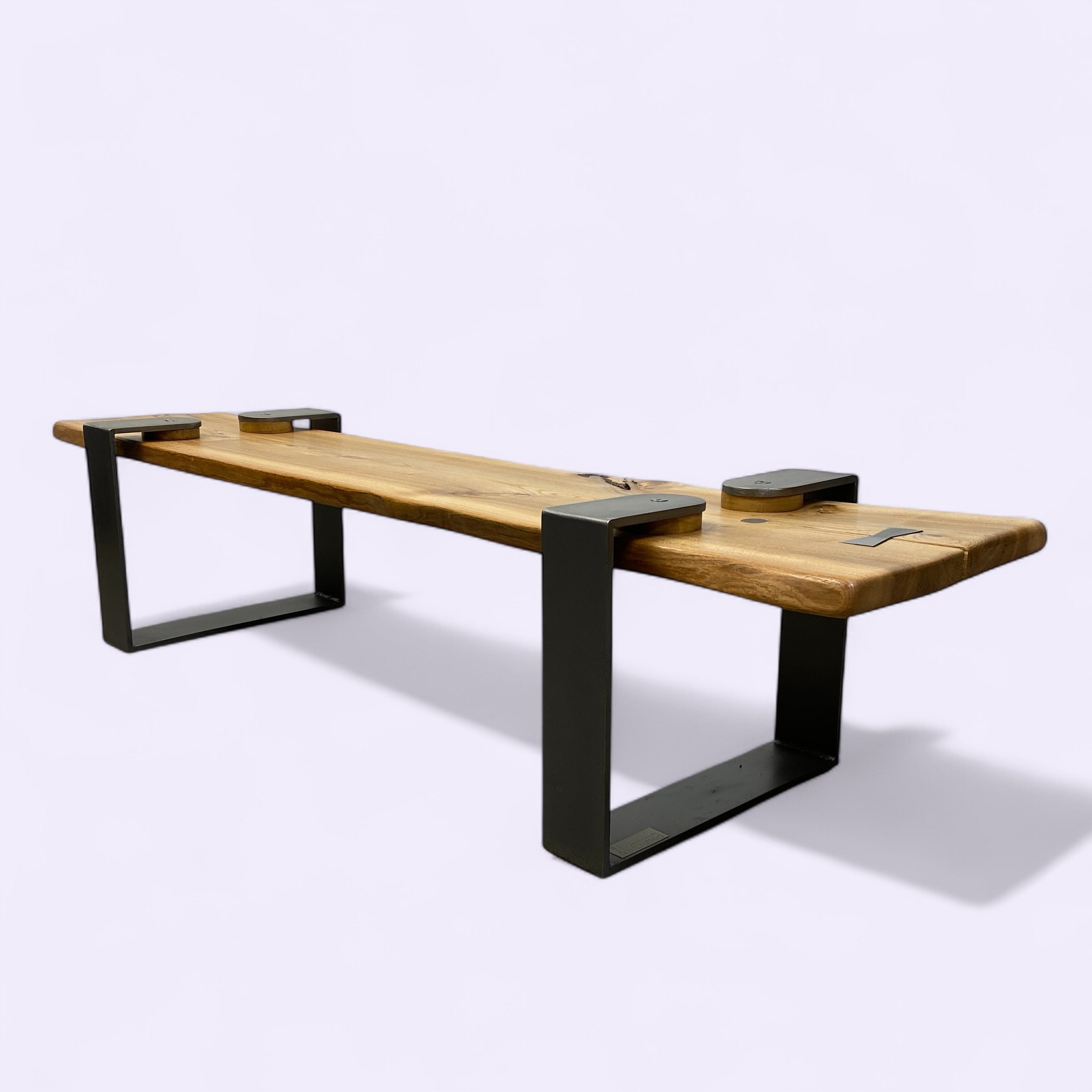 Wooden bench with black metal legs on a white background