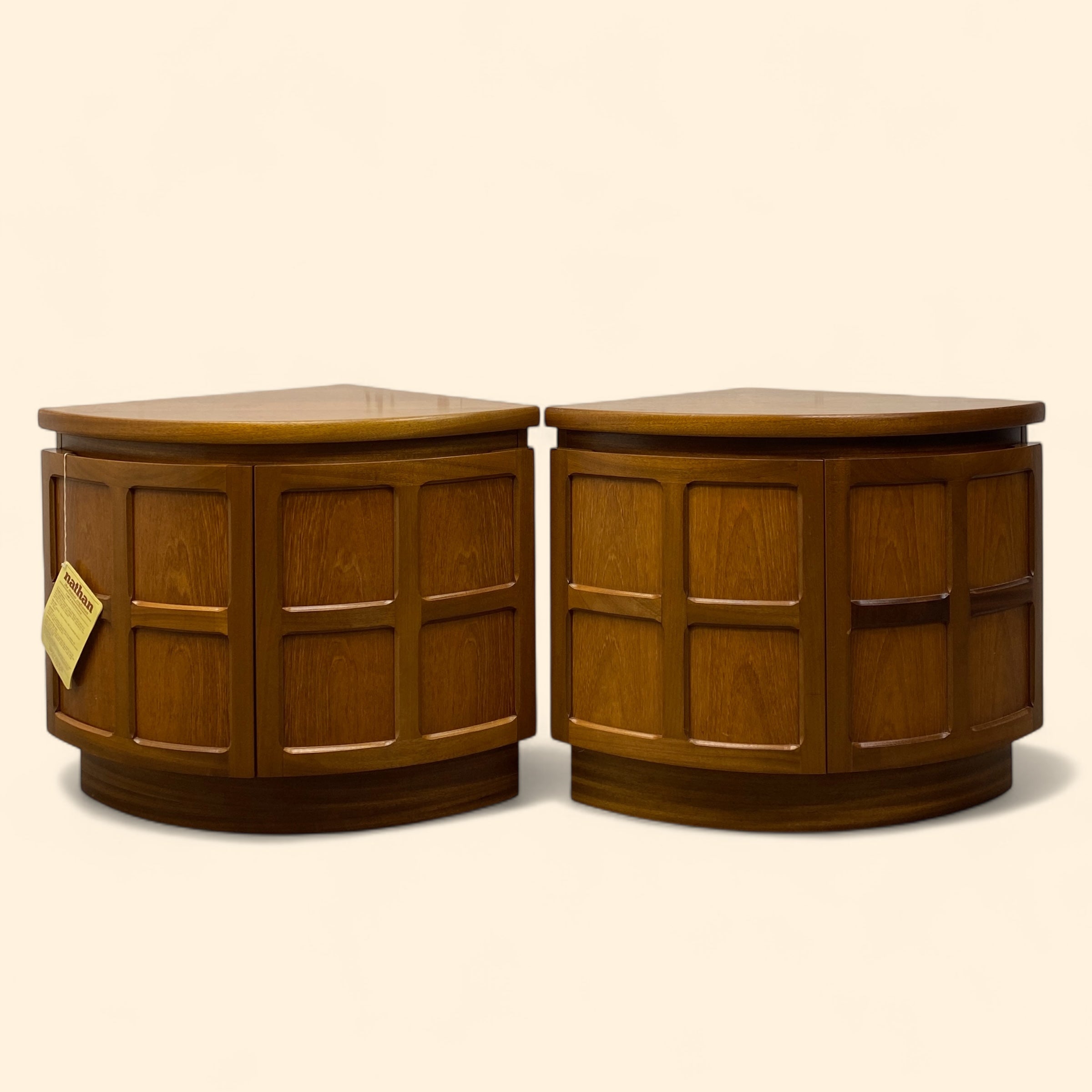 Pair of wooden side tables on a beige background