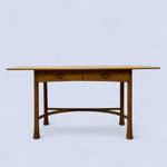 Load image into Gallery viewer, Wooden desk with two drawers on a light blue background
