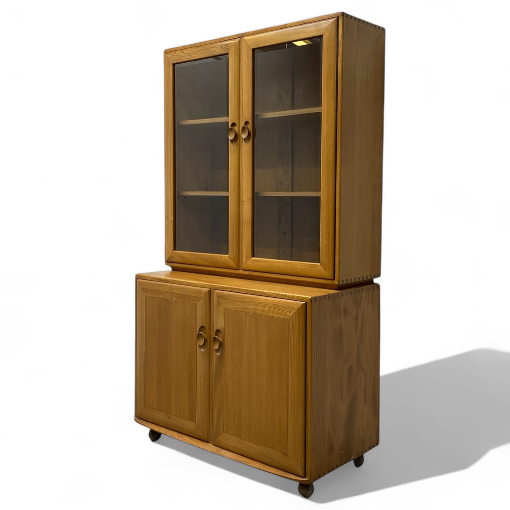Wooden cabinet with glass doors on a white background