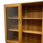 Load image into Gallery viewer, Wooden cabinet with glass door on a white background
