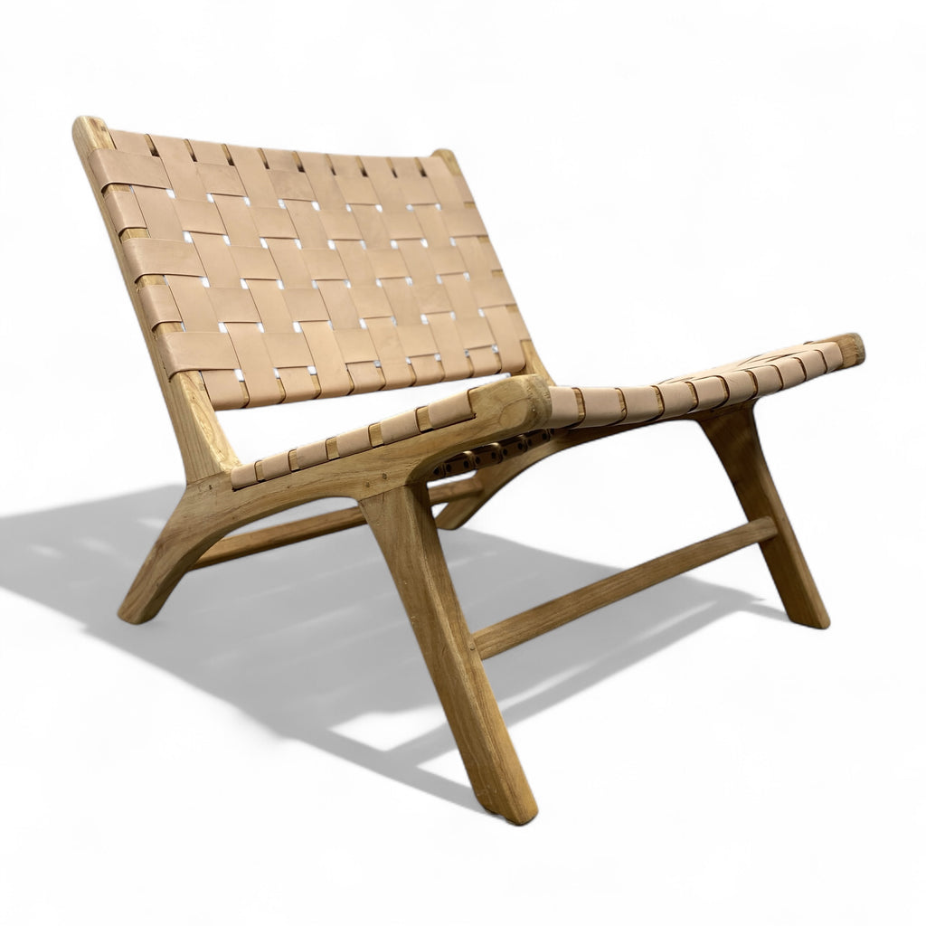 Wooden lounge chair with woven backrest on a white background