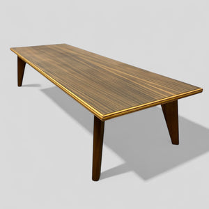 Wooden table with a brown finish on a gray background