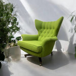 Load image into Gallery viewer, Green armchair in a room with plants
