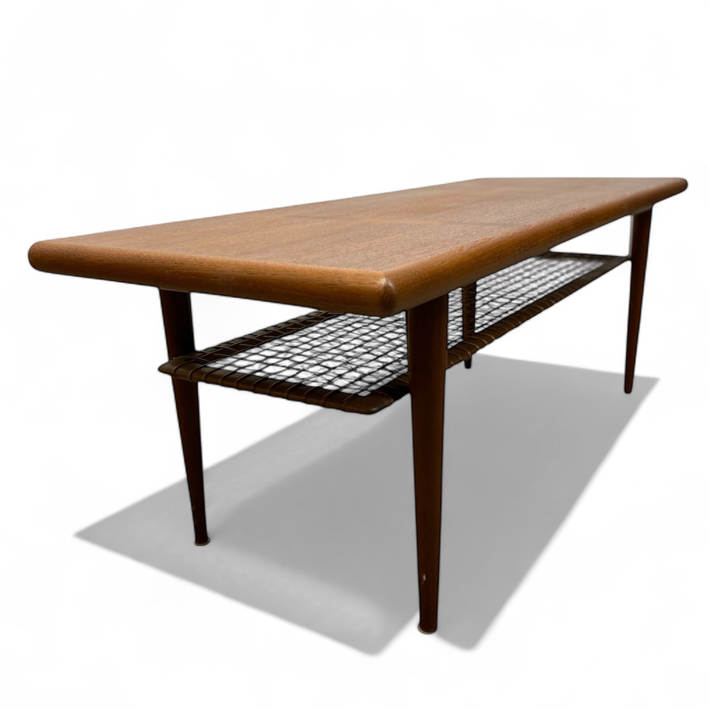 Teak coffee table with cane magazine shelf