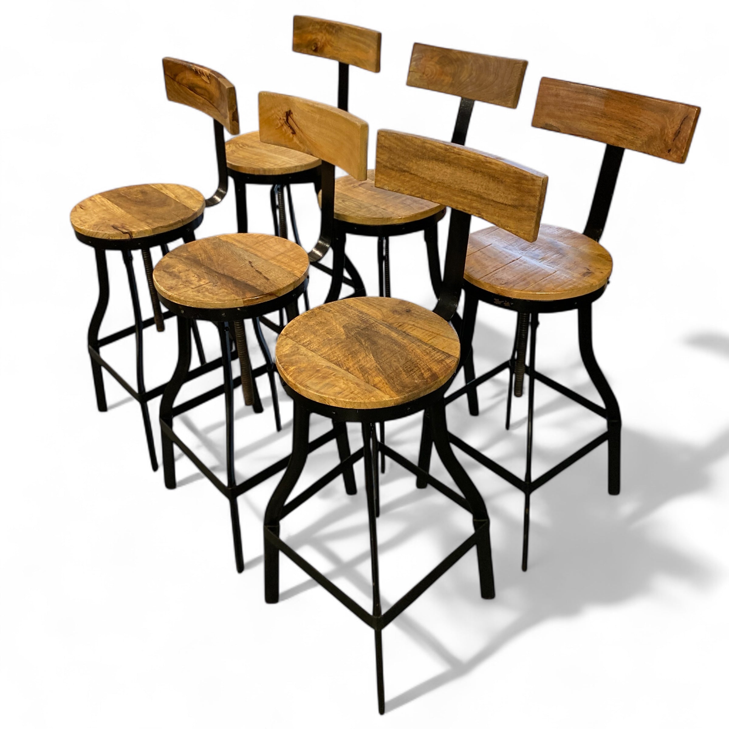 Set of wooden bar stools with black metal legs on a white background