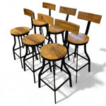 Load image into Gallery viewer, Set of wooden bar stools with black metal legs on a white background
