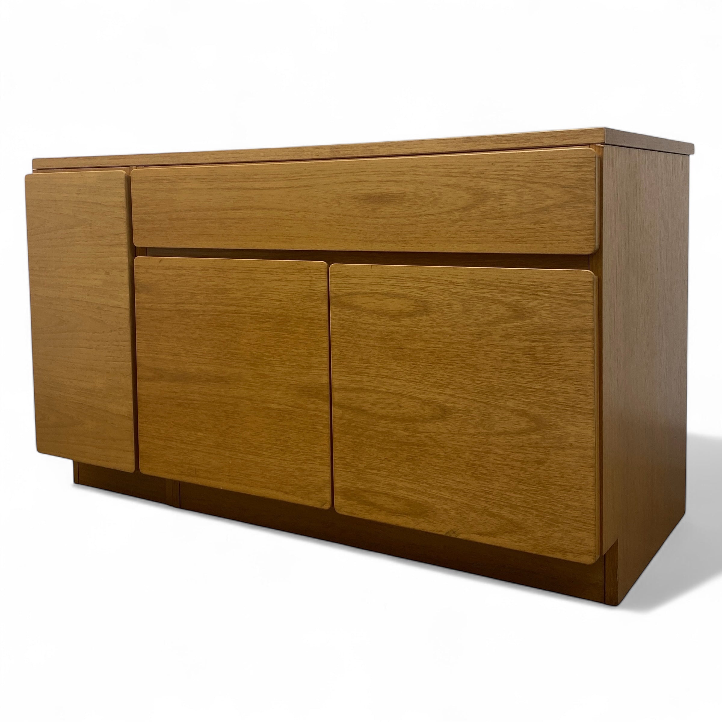 Wooden sideboard with three doors on a white background