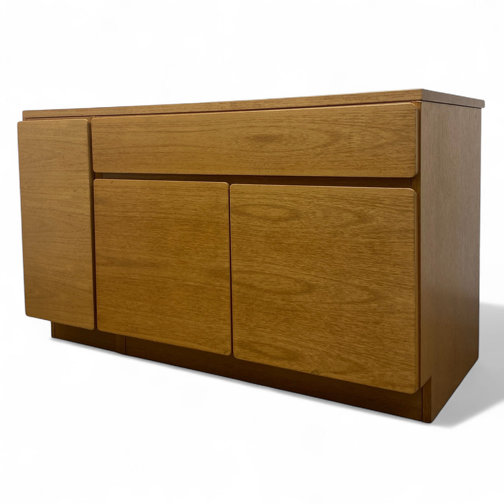 Wooden sideboard with three doors on a white background