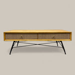 Load image into Gallery viewer, Wooden coffee table with wicker side panels on a plain background
