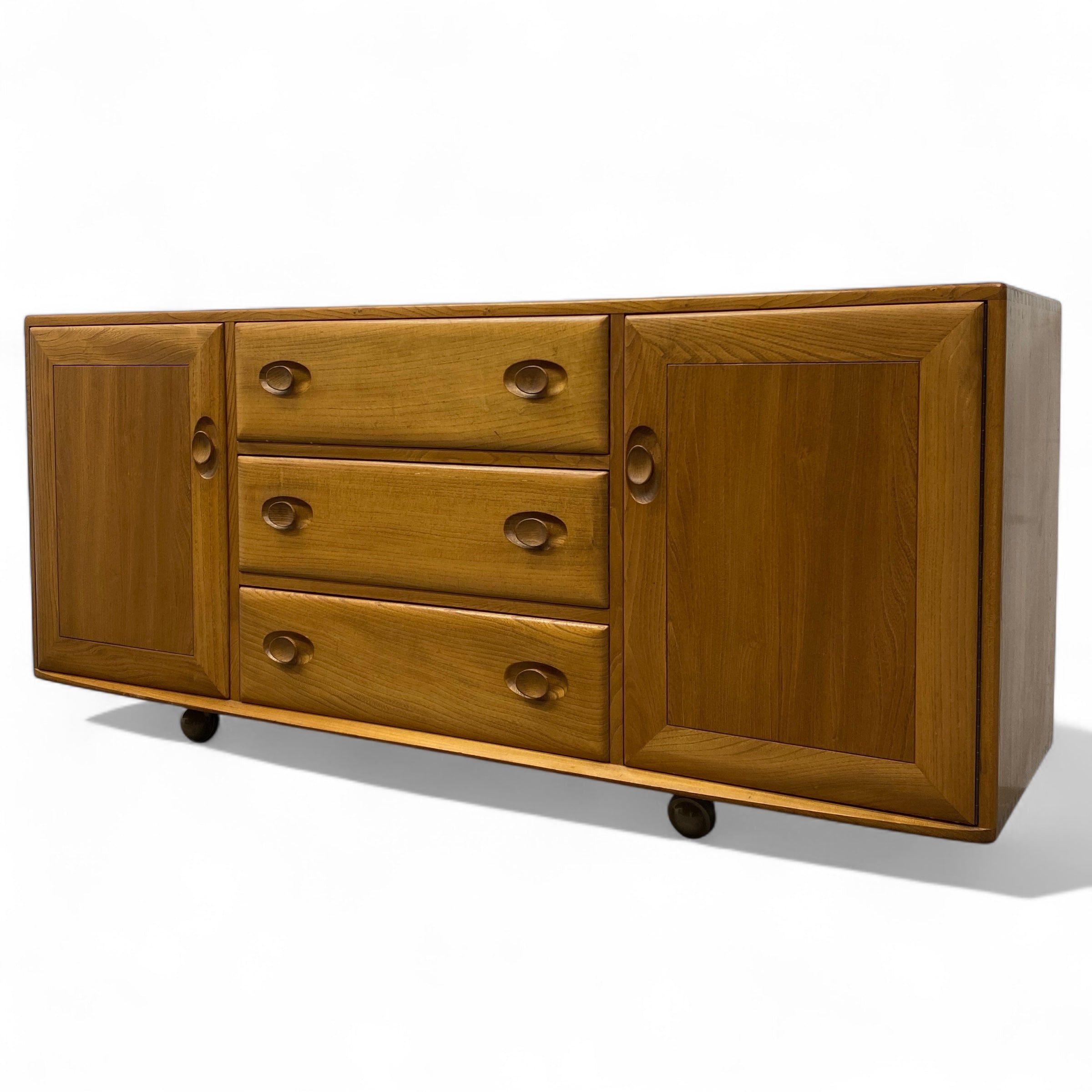 Wooden sideboard with drawers and doors on a white background