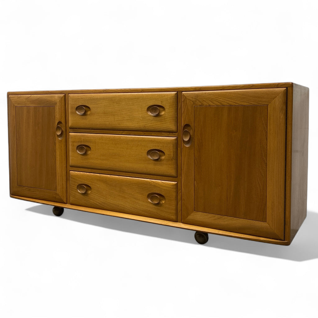 Wooden sideboard with drawers and doors on a white background