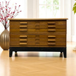 Load image into Gallery viewer, Wooden plan chest with multiple drawers in a room with a vase of flowers and a plant.
