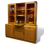 Load image into Gallery viewer, Wooden cabinet with glass doors displaying items on a white background
