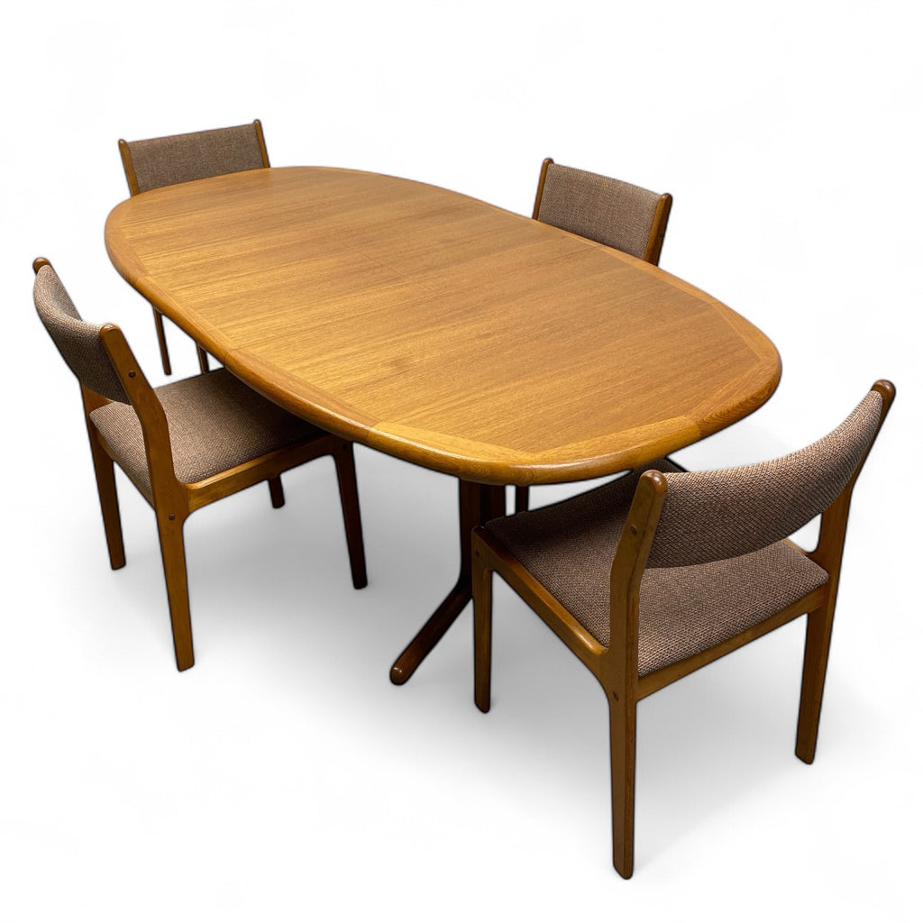 Wooden dining table with four matching chairs on a white background