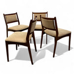 Load image into Gallery viewer, Four wooden chairs with beige cushioned seats on a white background
