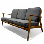 Load image into Gallery viewer, Three-seater sofa with wooden frame and grey cushions on a white background
