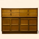 Load image into Gallery viewer, Wooden dresser with four drawers and four cabinets on a beige background
