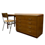 Load image into Gallery viewer, Wooden desk with multiple drawers and a chair on a white background
