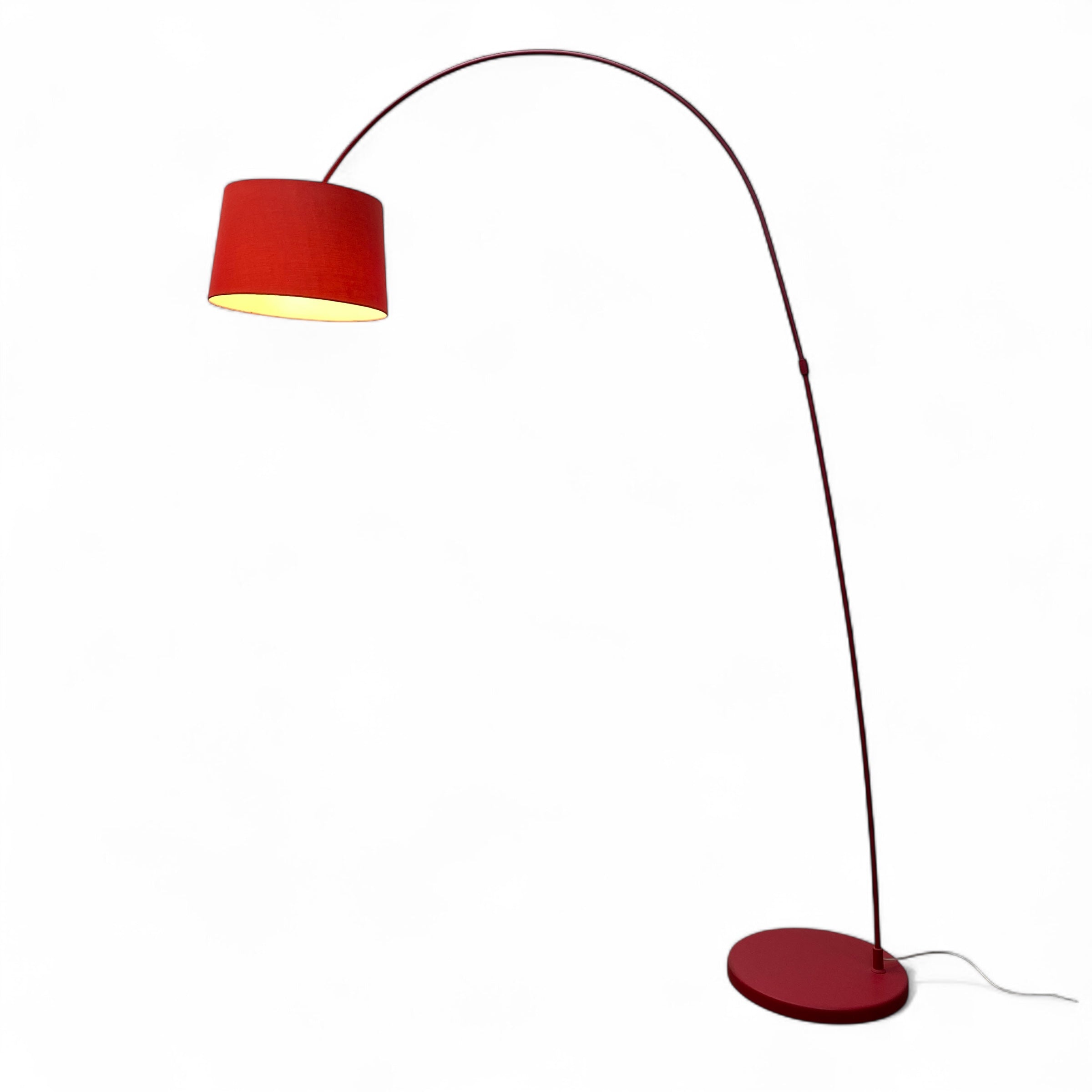 Red floor lamp with a curved arm on a white background