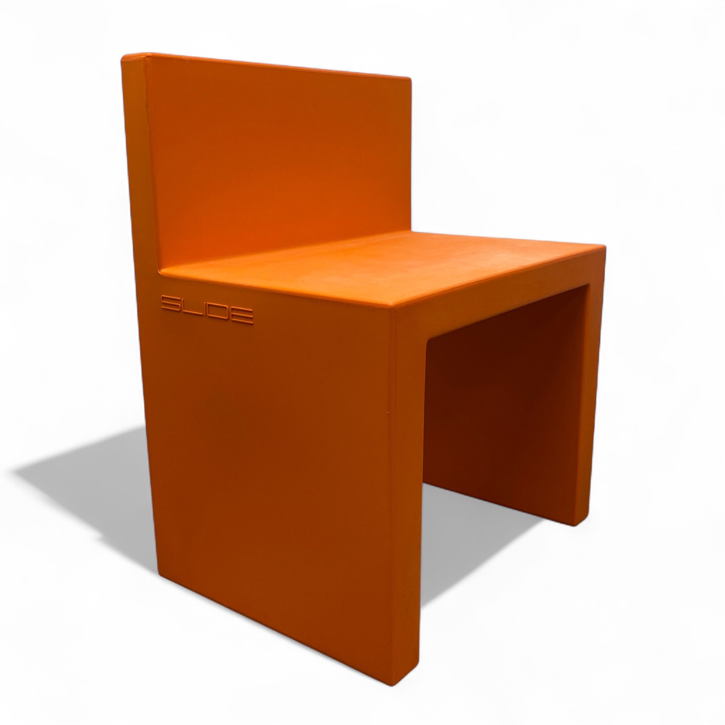 Orange chair with 'Slide' branding on a white background