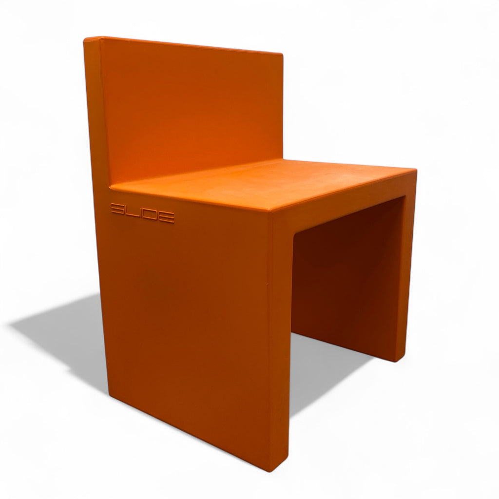 Orange chair with 'Slide' branding on a white background