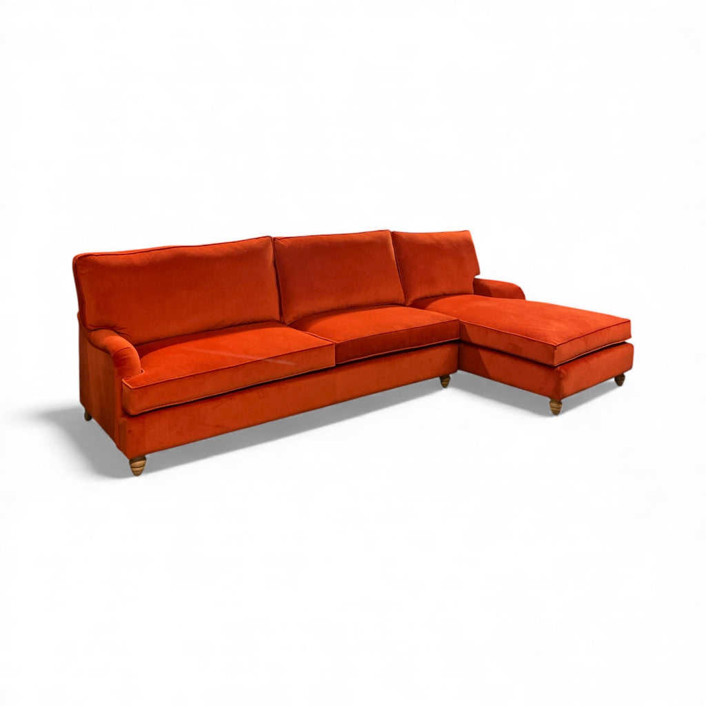 Orange sectional sofa on a white background