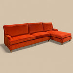 Load image into Gallery viewer, Orange sectional sofa on a beige background
