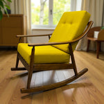 Load image into Gallery viewer, Yellow cushioned rocking chair on a wooden floor with a blurred background
