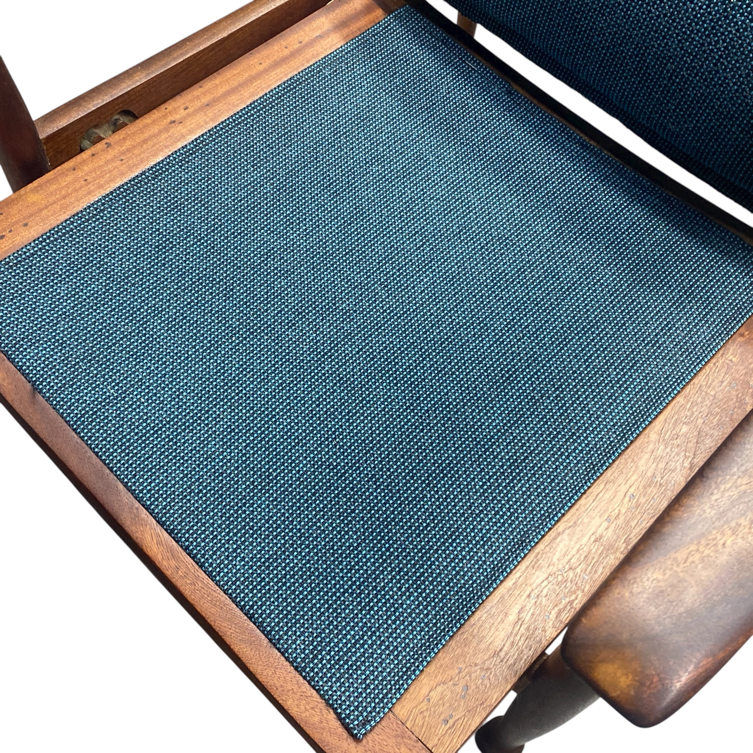 Blue textured mat on a wooden chair
