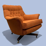 Load image into Gallery viewer, Orange armchair with tufted backrest on a light blue background
