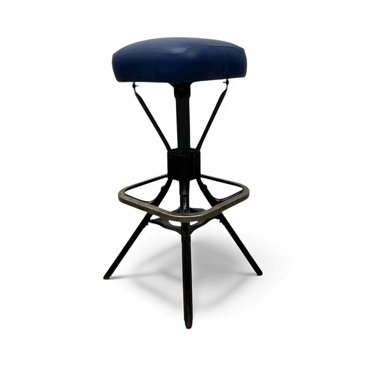 Black bar stool with a cushioned seat on a white background