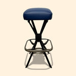 Load image into Gallery viewer, Bar stool with blue cushioned seat on a beige background

