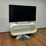 Load image into Gallery viewer, Modern white TV stand with a black flat-screen TV on a wooden floor.
