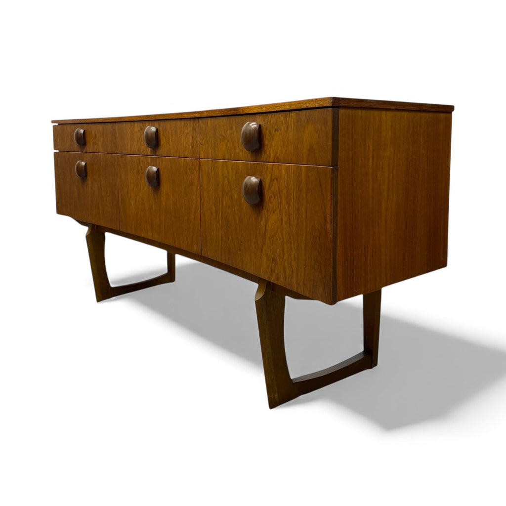 Wooden dresser with six drawers on a white background