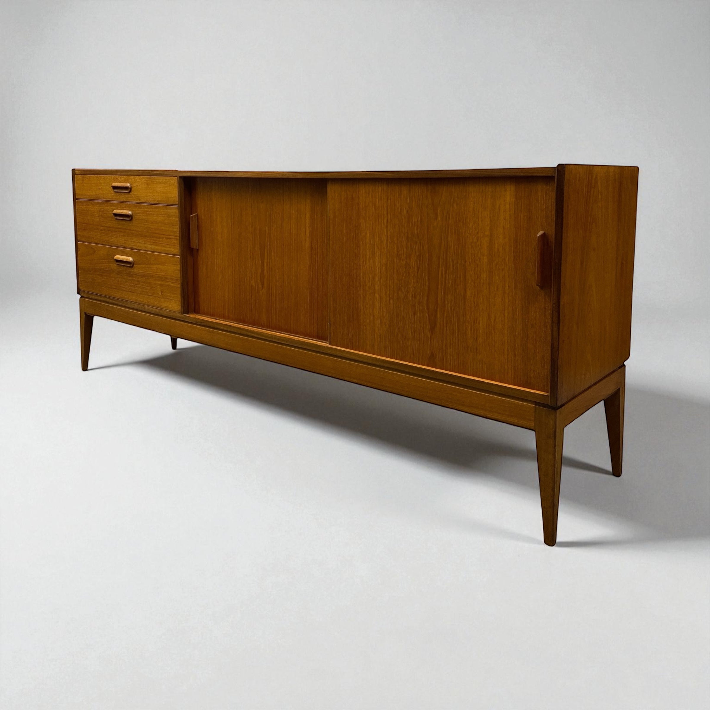 Wooden sideboard with drawers on a white background