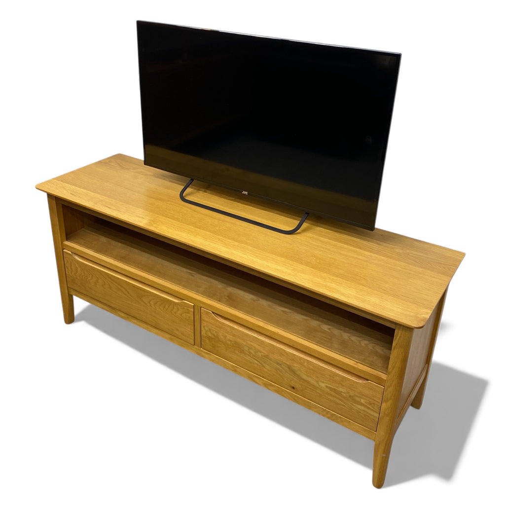 Wooden TV stand with a television on top against a white background