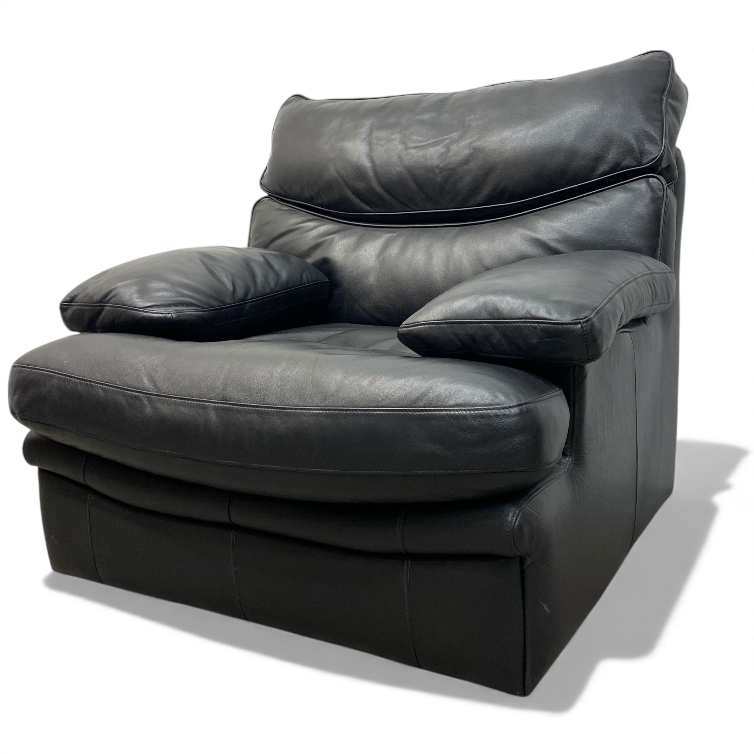 Black leather armchair on a white background